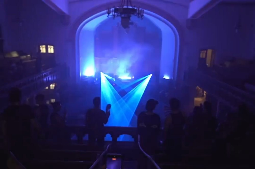 FratellisX event inside East End United, with blue lighting across the church interior